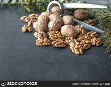 Walnuts on a black background, walnut kernels. Healthy food from walnut. Close-up.