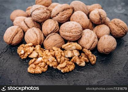 Walnuts on black background are ready to eat.