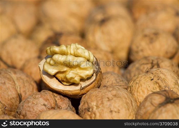 Walnuts pile on background texture