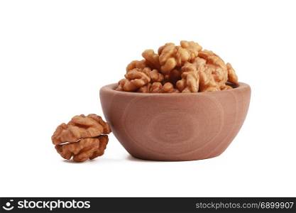 Walnuts shelled in a bowl isolated on white background. Side view. Walnut kernels in a bowl.. Walnuts shelled in a bowl isolated on white background. Side view. Walnut kernels in a bowl