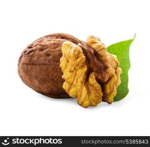 Walnuts with shell and green leaf isolated