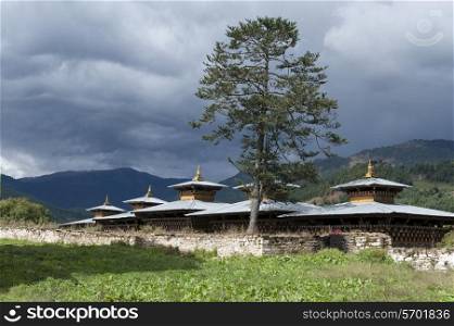 Wangdichholing Palace with mountains in the background, Chokhor Valley, Bumthang District, Bhutan