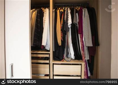 Wardrobe with messy clothes, closeup fashion design colors. Wardrobe with messy clothes, closeup, fashion design