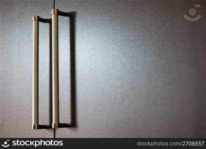 wardrobe with silver handles under soft light