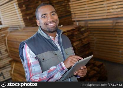 warehouse clerk holding a tablet