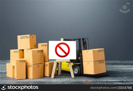 Warehouse with boxes and forklift and easel with prohibition sign NO. Out of stock. Restrictions ban on import goods. Sanctions, trade wars. Isolation and quarantine. manufacturers production slowdown