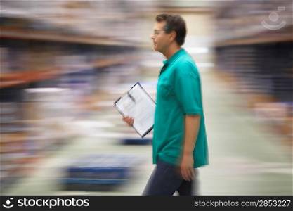 Warehouse Worker Carrying a Clipboard