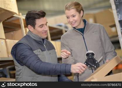 warehouse worker checking stock products for shipping