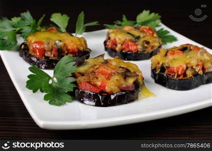 Warm appetizer of eggplant stuffed with vegetables and cheese