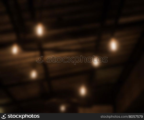 Warm lighting lamps on ceiling in coffee shop, stock photo