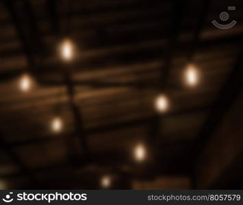 Warm lighting lamps on ceiling in coffee shop, stock photo