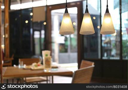 Warm lighting modern ceiling lamps in the cafe and interior decoration restaurant.