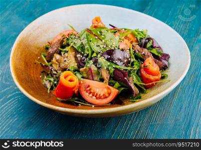 Warm salad with grilled meat and vegetables