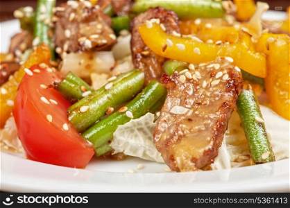 Warm salad with veal closeup