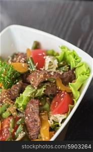 Warm salad with veal. Warm salad with veal closeup