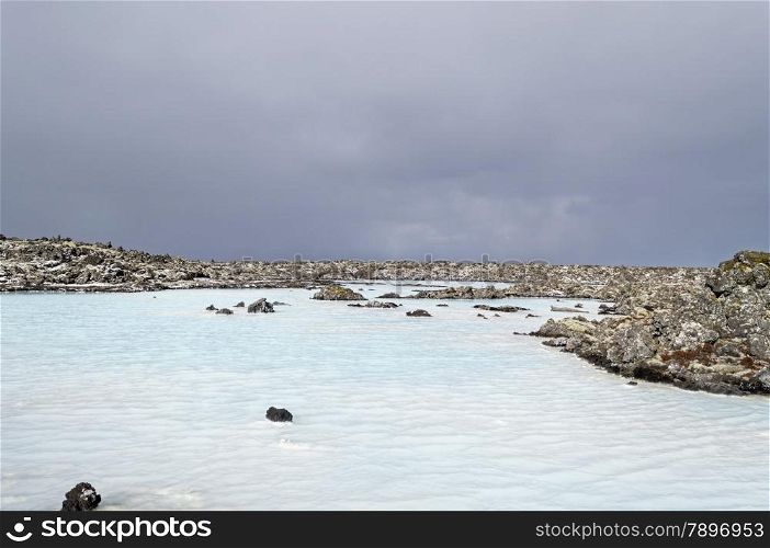 warm water in blue lagoon iceland surrounding by ice and snow