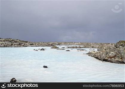 warm water in blue lagoon iceland surrounding by ice and snow