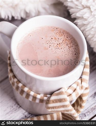 Warming drink - cup of cocoa with milk on the table