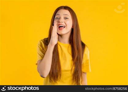 WARNING  Pretty smiling woman calling you for attention, shouts isolated on yellow. Announcement concept, sale, advertising. High quality photo. WARNING  Pretty smiling woman calling you for attention, shouts isolated on yellow. Announcement concept, sale, advertising.