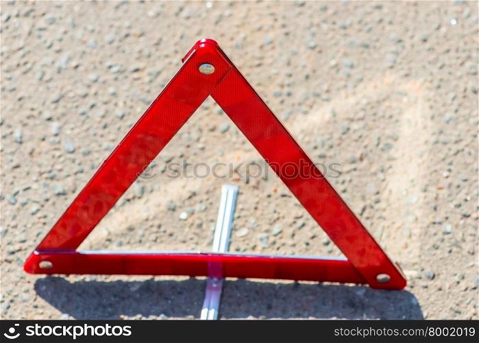 warning triangle on the asphalt is photographed close-up
