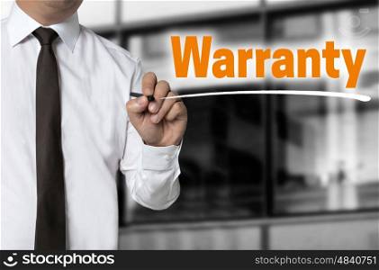 Warranty is written by businessman background concept. Warranty is written by businessman background concept.