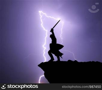 Warrior silhoutte and lightning. Strenght and power conceptual scene.