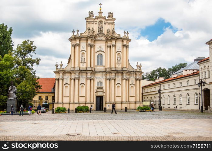 WARSAW - July 20: Parks, Castle Square, fountains filled with tourists in the Old Town of Warsaw, Poland, July 20, 2017. WARSAW - July 20: Parks, fountains filled with tourists in the Old Town of Warsaw, Poland, July 20, 2017