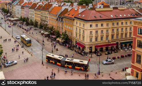 WARSAW - July 20: Parks, Castle Square, fountains filled with tourists in the Old Town of Warsaw, Poland, July 20, 2017. WARSAW - July 20: Parks, fountains filled with tourists in the Old Town of Warsaw, Poland, July 20, 2017