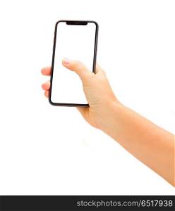WARSAW, POLAND - DECEMBER 02,2017: Hand holding new Iphone X mobile phone over white background. New Iphone X. New Iphone X