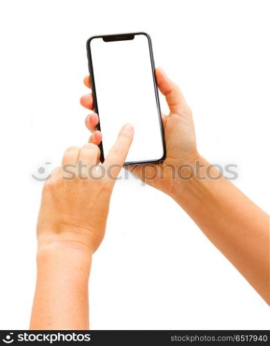 WARSAW, POLAND - DECEMBER 02: Two hands holding and touching new Iphone X modern mobile phone over white background. New Iphone X. New Iphone X