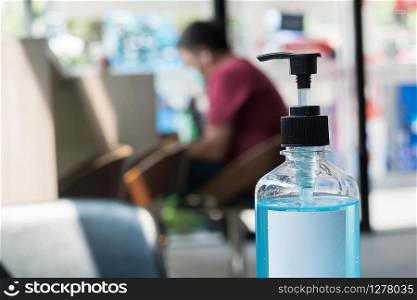 wash hand sanitizer gel bottle against Novel coronavirus or Corona Virus Disease (Covid-19) at office Indoor. Antiseptic, Hygiene and Healthcare concept