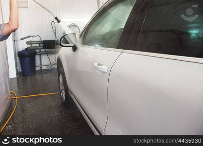 washing car closeup. car washing with high pressure water