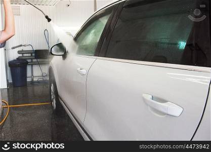 washing car closeup. car washing with high pressure water