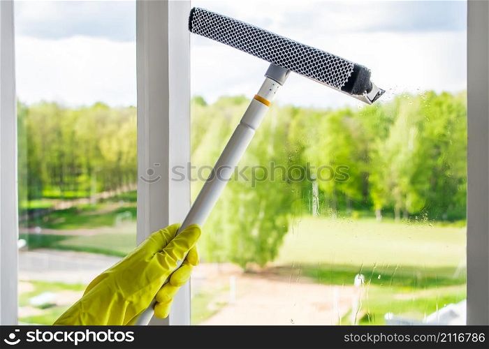 Washing dirty windows and home cleaning. Housework concept.. Washing windows and home cleaning. Housework concept.