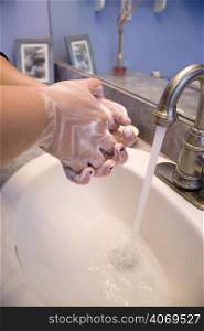 Washing hands, silver tap