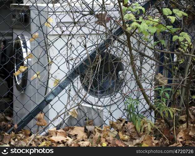 Washing Machines. Washing machines behind a fence in the fall