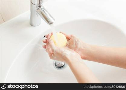 Washing of hands in bathroom, close up photo