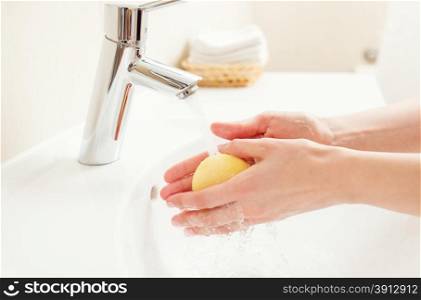 Washing of hands in bathroom, close up photo