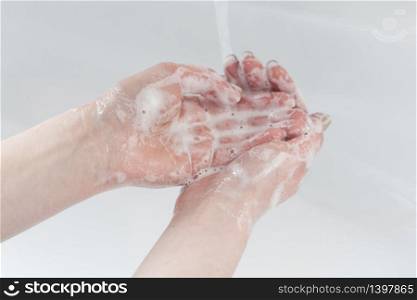 Washing thoroughly your hands with water and soap
