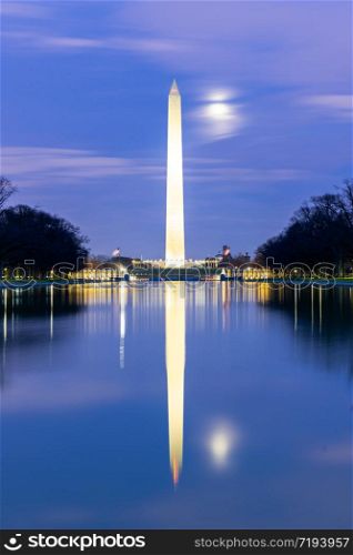 Washington Monument in new reflecting pool from Lincoln Memorial at sunset night.This monument is obelisk on the National Mall one of landmark of Washington DC USA.