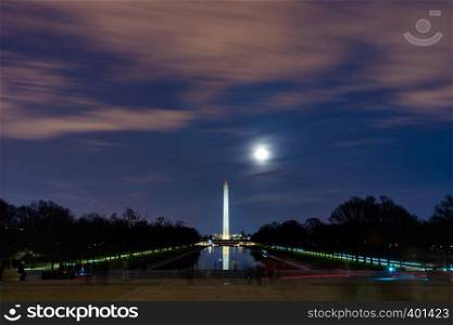 Washington Monument in new reflecting pool from Lincoln Memorial at sunset. Washington DC USA