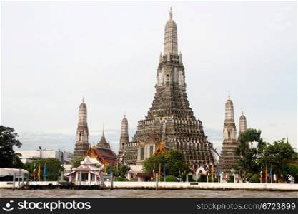 Wat Arun and bank of river Chao Phraya in Bangkok, Thailand