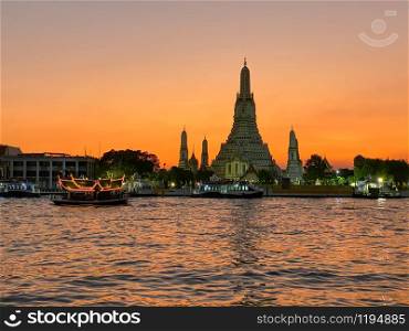 Wat Arun and Chao Phraya at sunset, Bangkok.