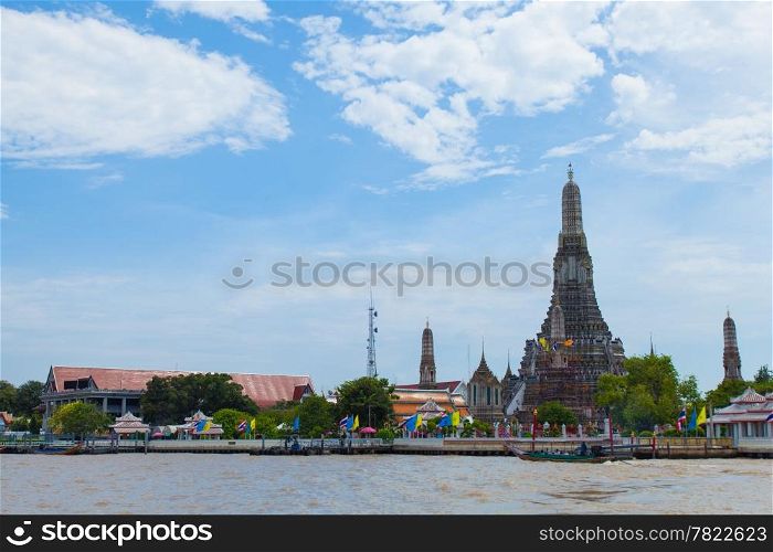 Wat Arun, Bangkok&rsquo;s main attractions. The tower and adjacent river.