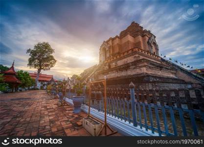 Wat Chedi Luang is a Buddhist temple in the historic centre and is a Buddhist temple is a major tourist attraction in Chiang Mai,Thailand.at twilight time blue sky clouds sunset background.