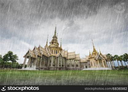Wat Luang Pho Toh temple with falling rain in Nakhon Ratchasima province, Thailand