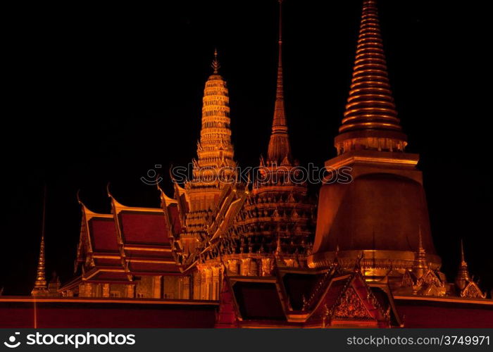 Wat Phra Kaeo in the evening. Red light bulb. The exotic atmosphere in the evening.