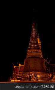 Wat Phra Kaeo in the evening. Red light bulb. The exotic atmosphere in the evening.