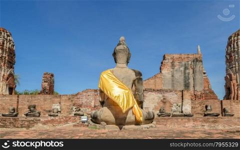 Wat Phra Mahathat ruins in Ayuthaya historic park, Thailand. Back view of Buddha stute.