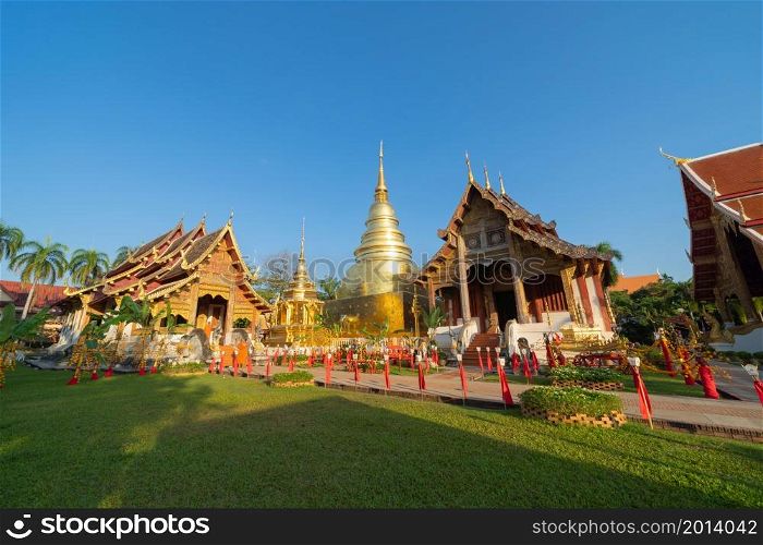 Wat Phra Singh Woramahawihan golden pagoda or stupa of buddhist Temple, Chiang Mai City, Thailand. Thai architecture. Tourist attraction landmark.